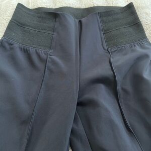 Size Medium dark Navy cropped stretch pant with ankle zipper on back.